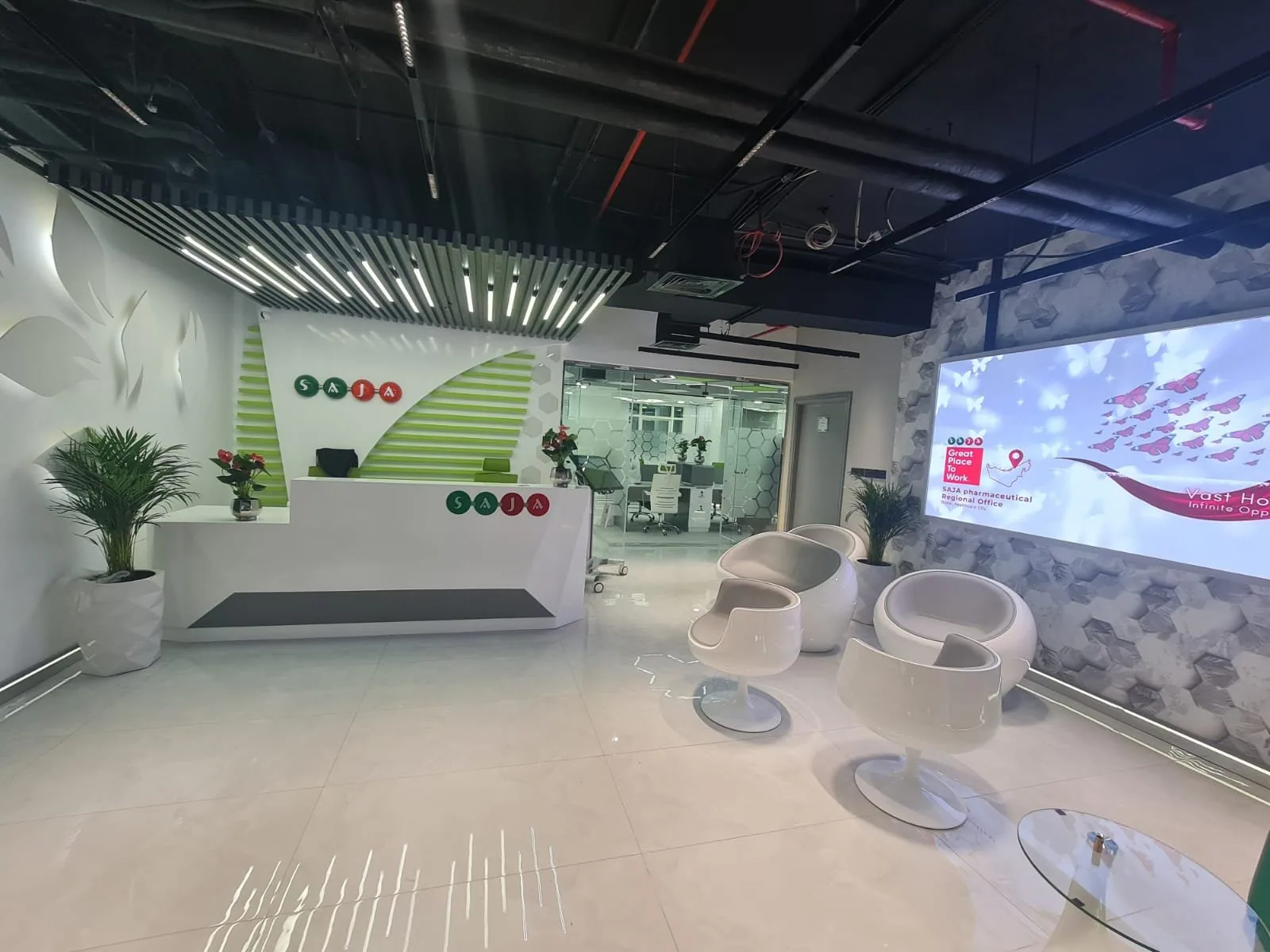 Corporate headquarters reception lounge with LED feature wall