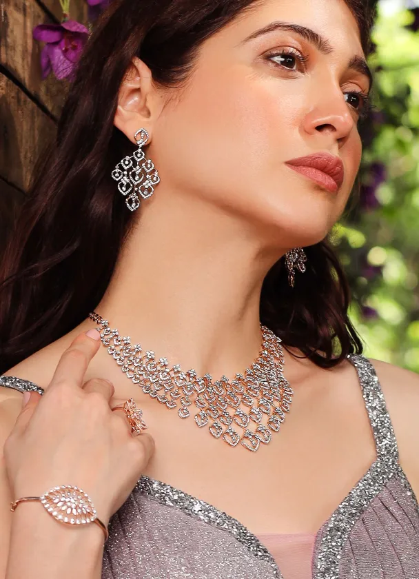 Model wearing a diamond necklace, earrings and bracelet set