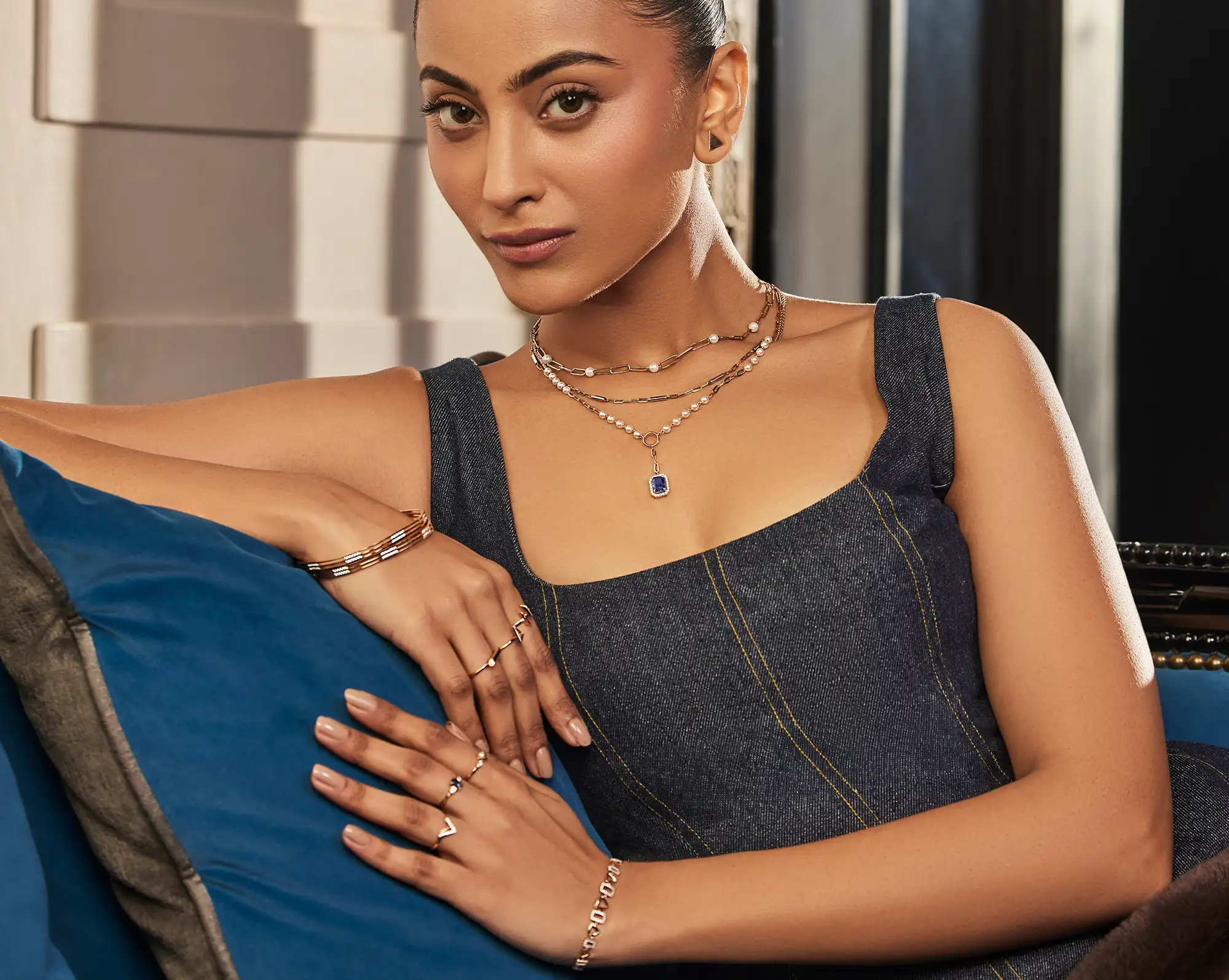 Meralda Jewels campaign — layered gold necklaces, rings and bracelets