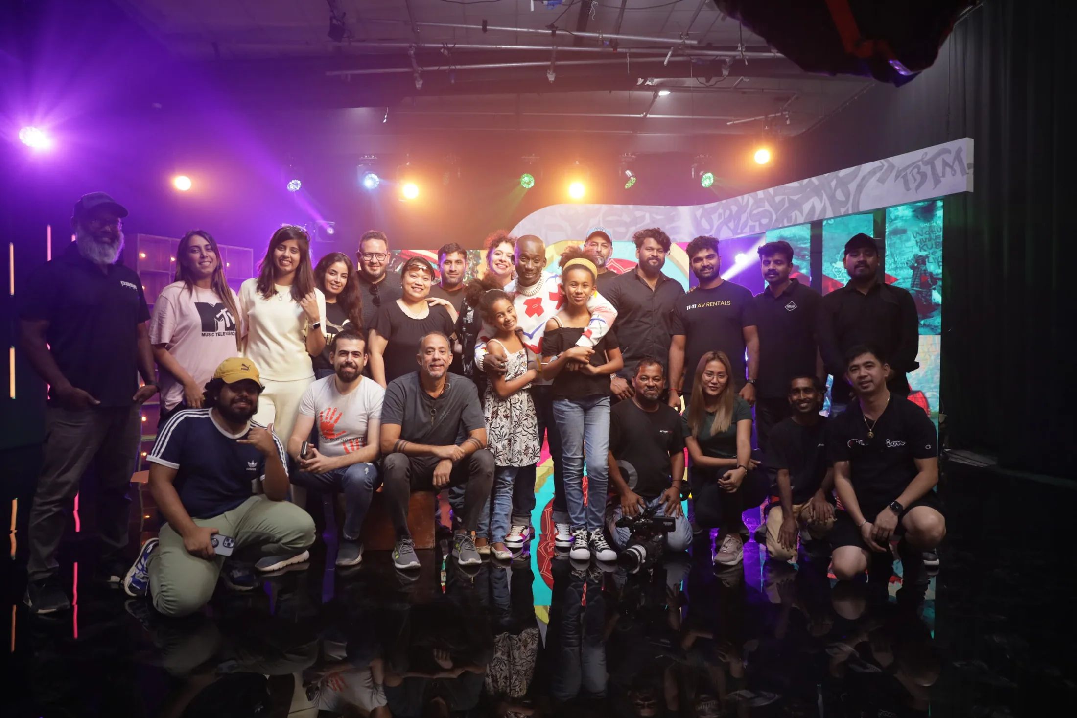 Production crew and guests on a completed stage set