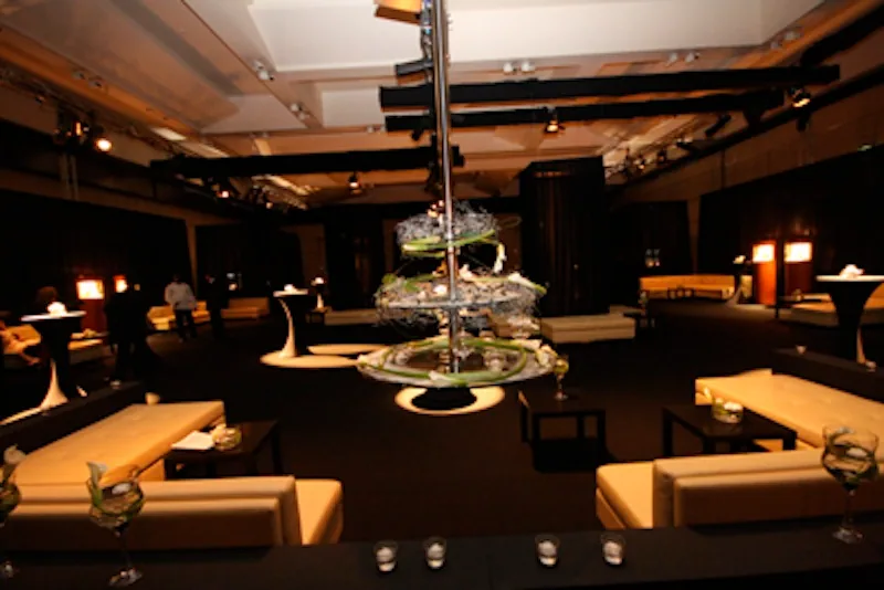 Ballroom set for a conference gala dinner with feature lighting
