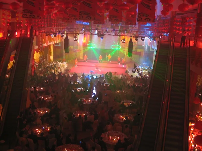 Concert lighting rig with beams over a live stage