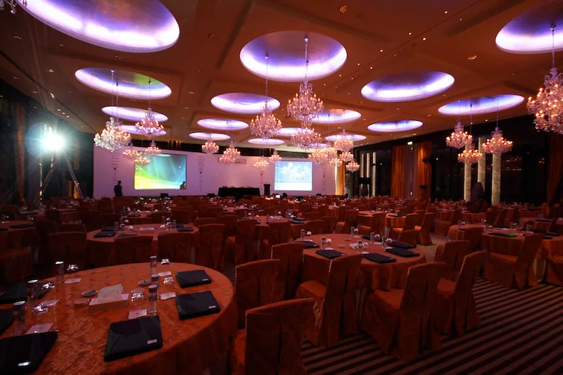 Dark immersive brand experience installation with framed lit displays