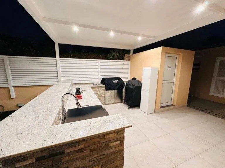 Outdoor BBQ kitchen with stone counter