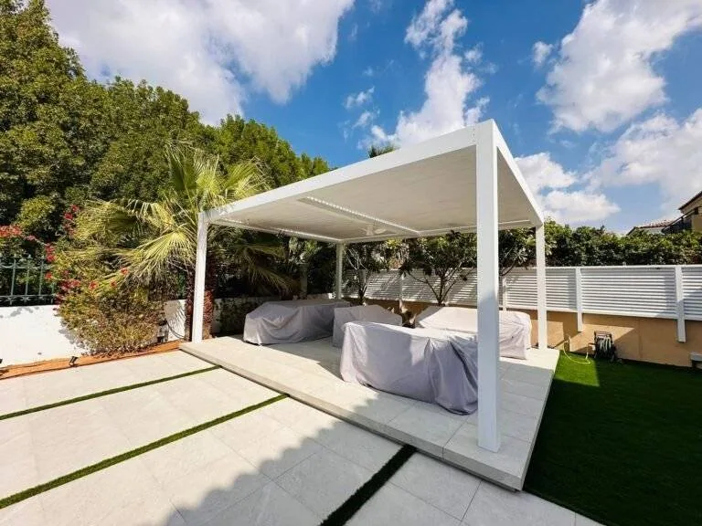 Garden seating area on landscaped lawn