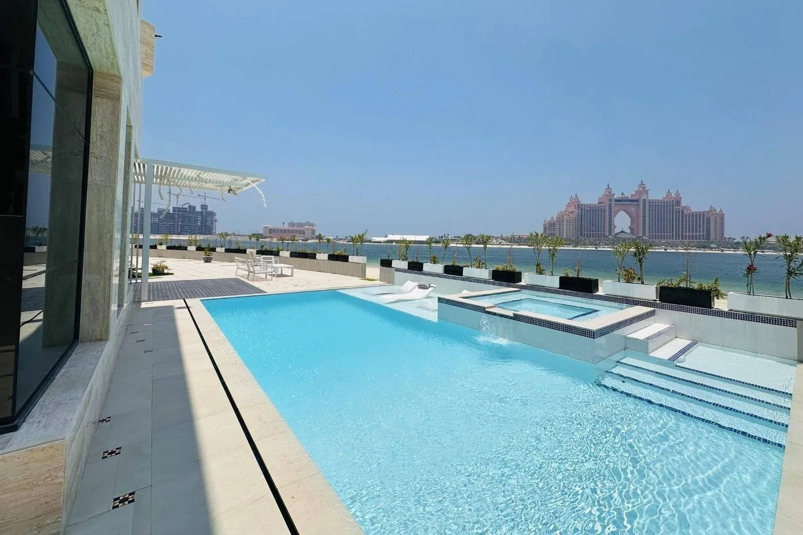 Modern villa swimming pool and landscaped garden in Dubai