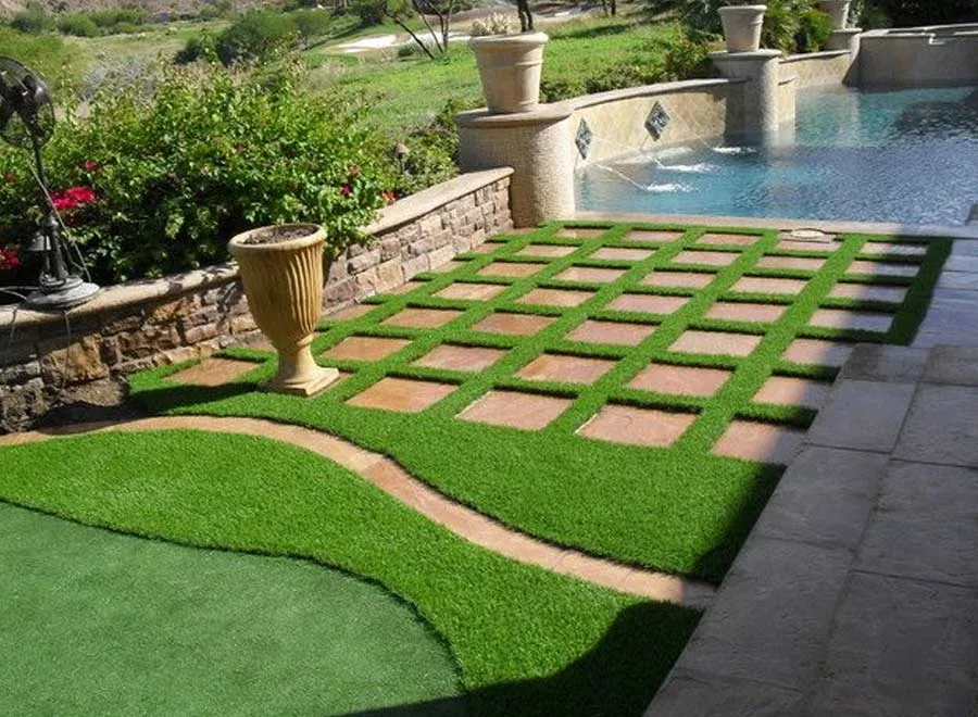 Completed villa garden with mature olive tree and manicured lawn, Dubai
