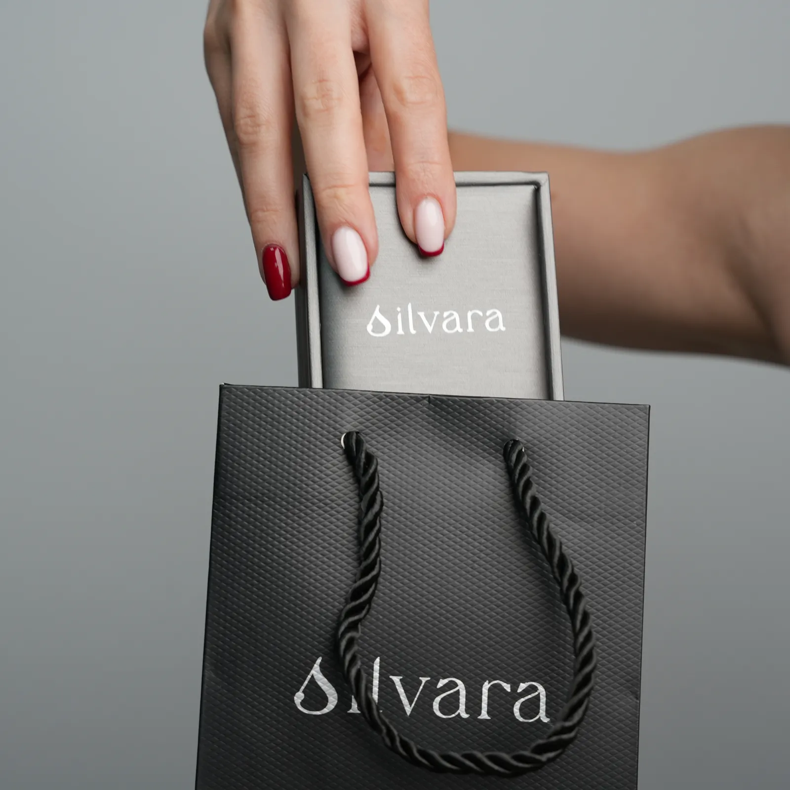 A Silvara gift box and ribbon-handle bag