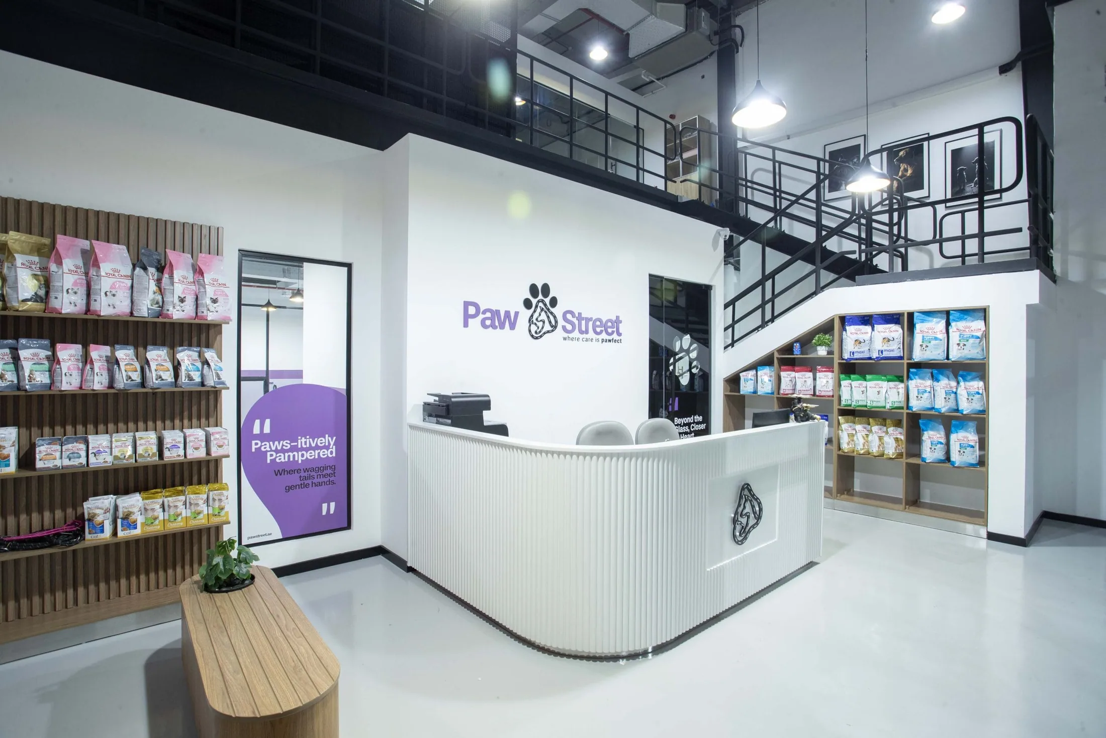 Paw Street's bright reception area with the brand logo, retail shelves and a welcoming front desk