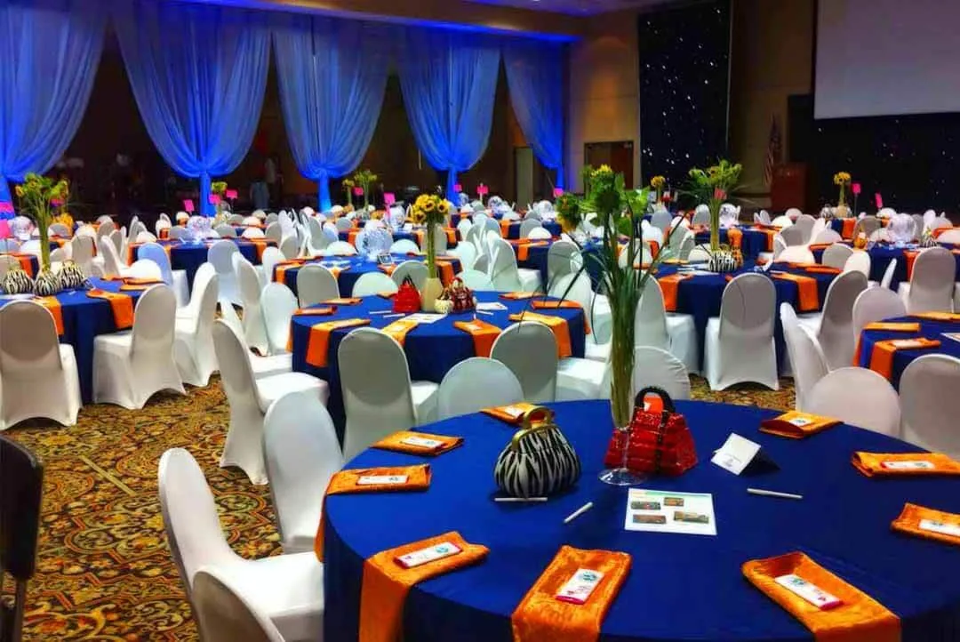 Styled event setup with navy and gold décor