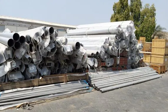 Large-bore stainless steel pipe and tube held outdoors