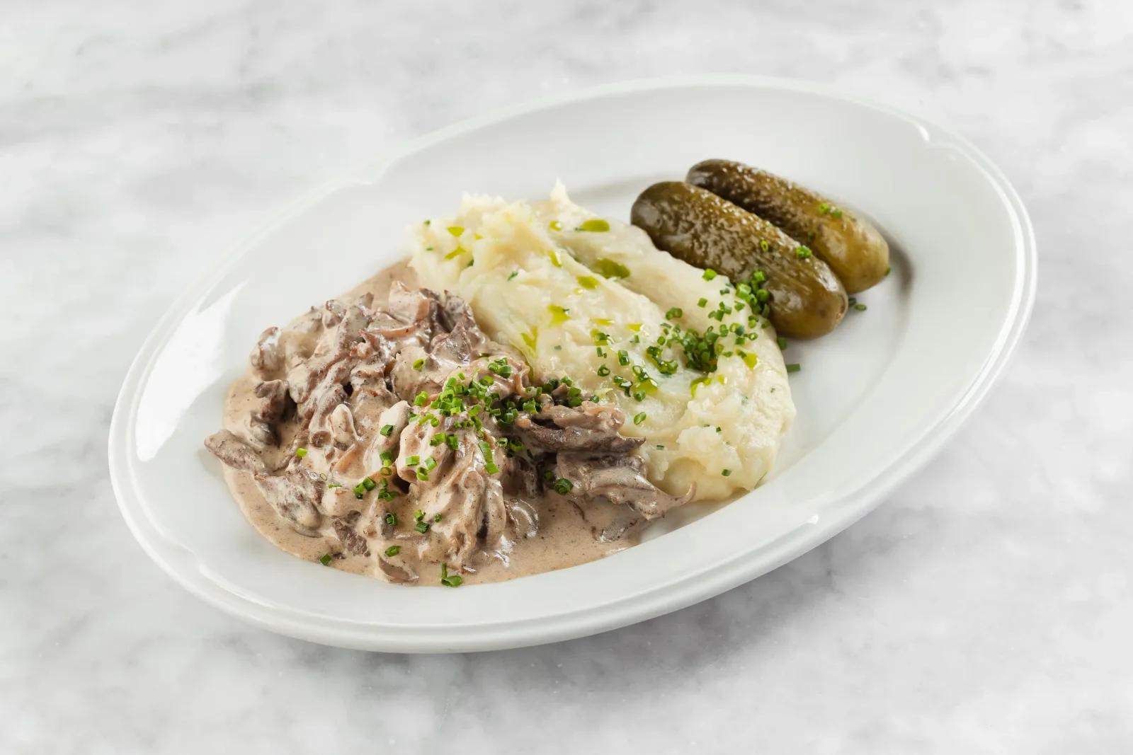 Beef stroganoff with mash and pickles