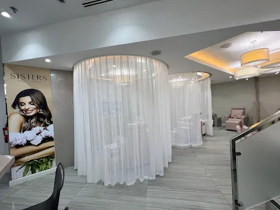 Curtained treatment pods in the lounge
