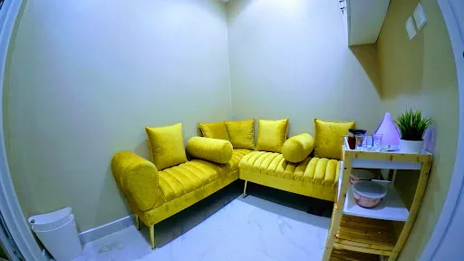 Soft mustard velvet relaxation corner in the lounge