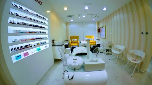 Nail bar with a full wall of polish shades