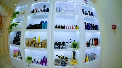 Curved retail shelving displaying professional salon products