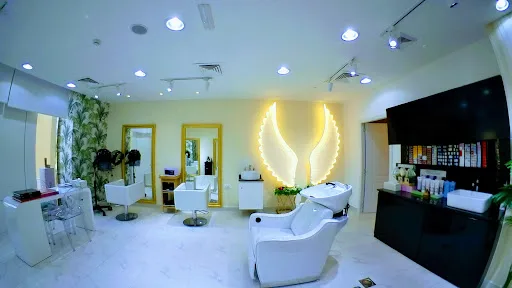 Hair styling station with gold mirror and the illuminated wing wall