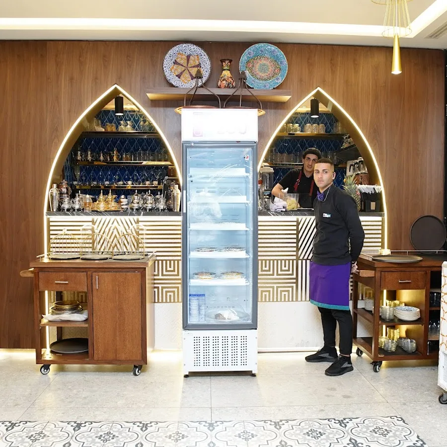 ZouZou bakery and dessert counter with staff and decorative Turkish plates
