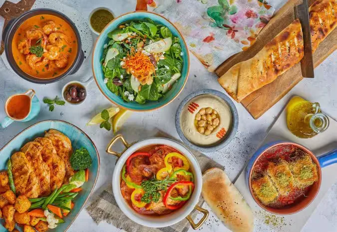 A spread of Levantine dishes served at Hashtag Cafe & Restaurant — salads, hummus, grills, stews and fresh bread