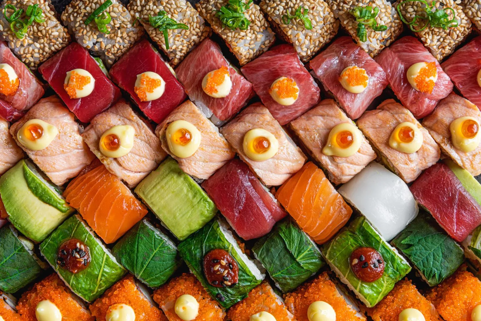 Overhead view of a colourful spread of assorted sushi