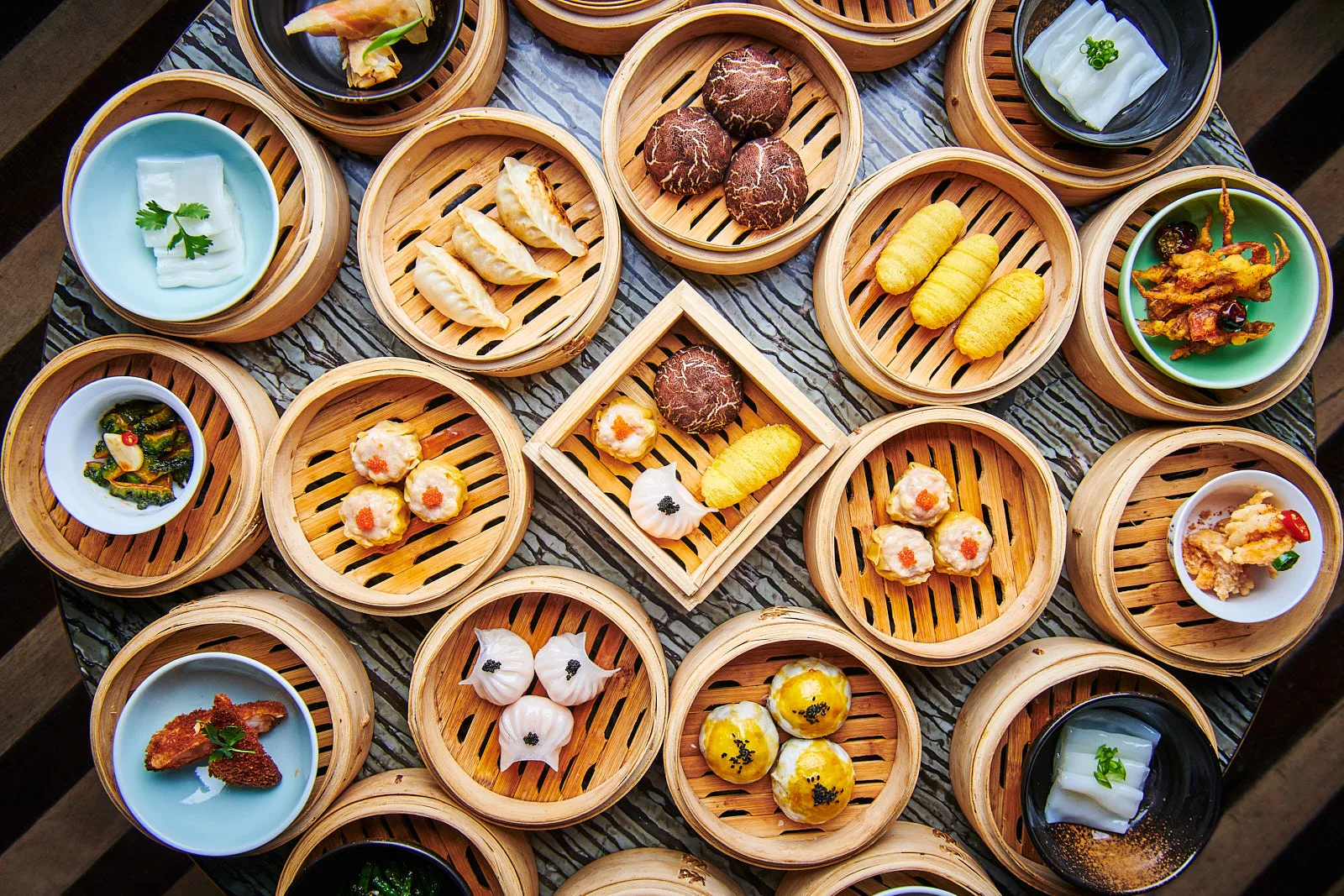 Overhead spread of dim sum in bamboo steamers at Maiden Shanghai