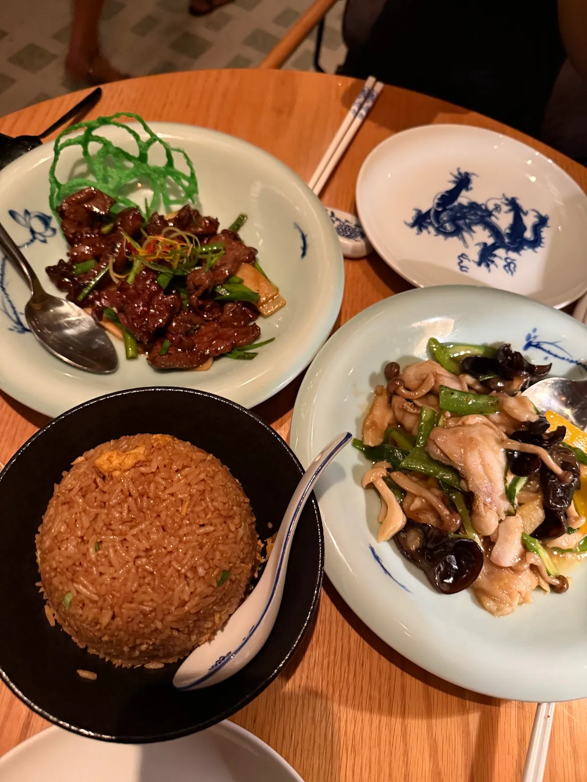 Wok dishes served on blue-and-white dragon porcelain
