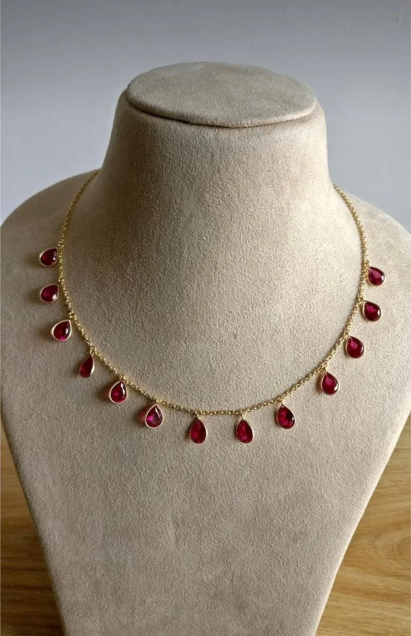 Gold and ruby necklace set on display