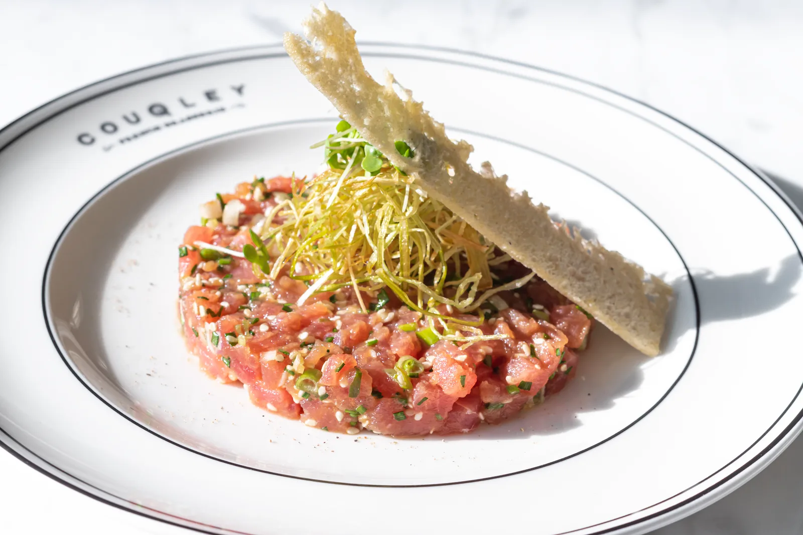 Tuna tartare plated on a Couqley dish