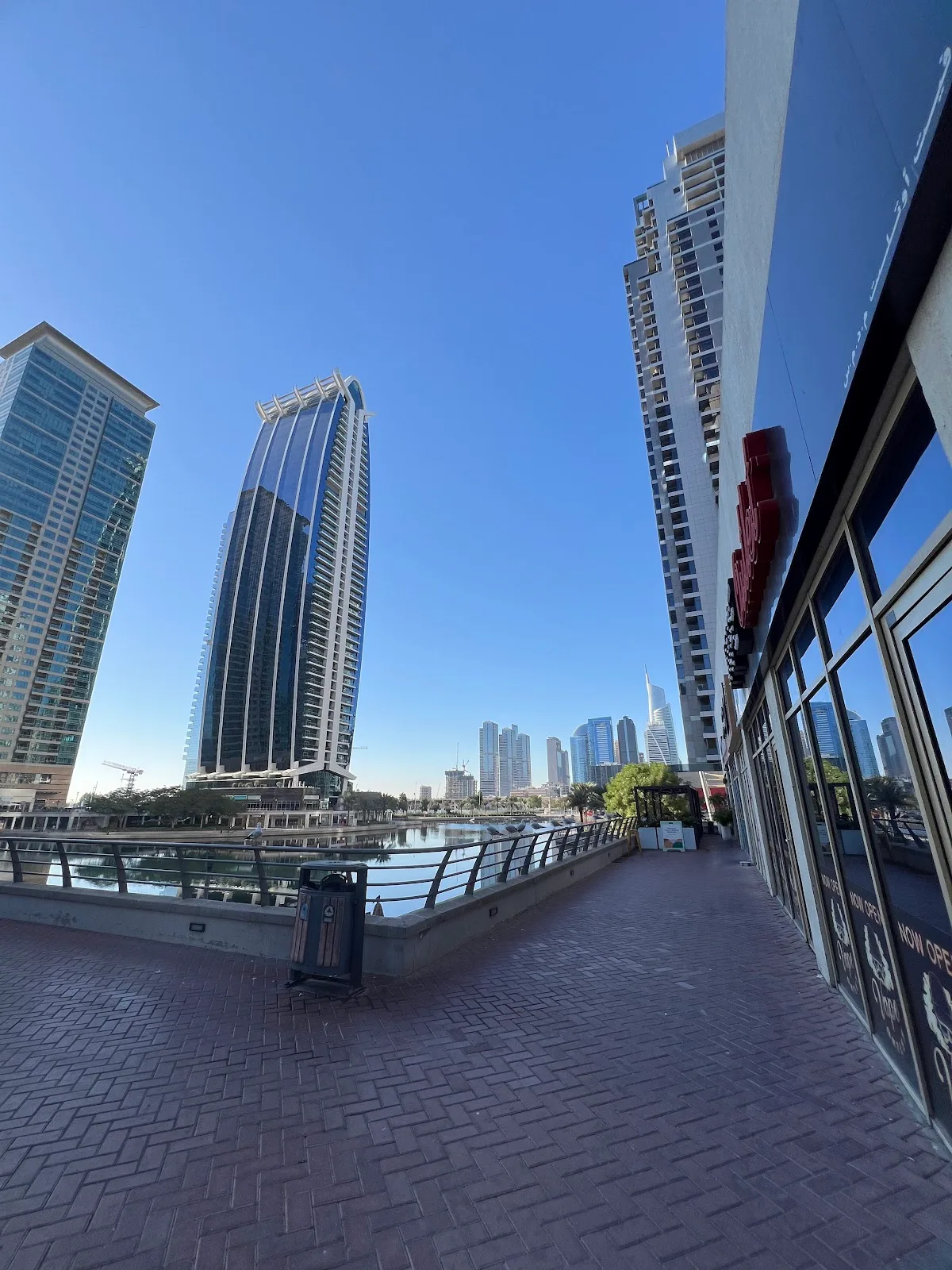 Jumeirah Lakes Towers waterfront promenade with towers and lake