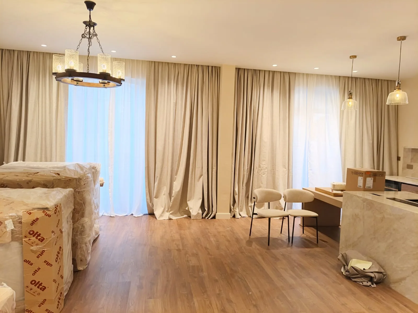 Full-length tailored curtains in a Dubai living room