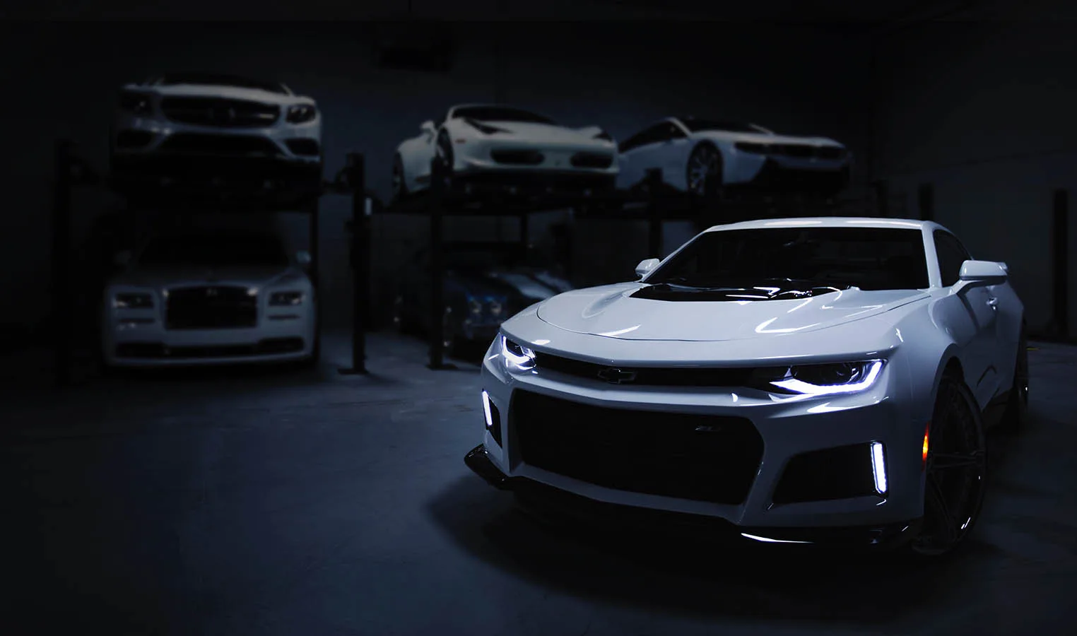 Freshly detailed cars under studio lighting at Crystal Shine Car Care, Dubai