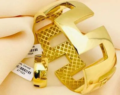 A bold polished gold bangle