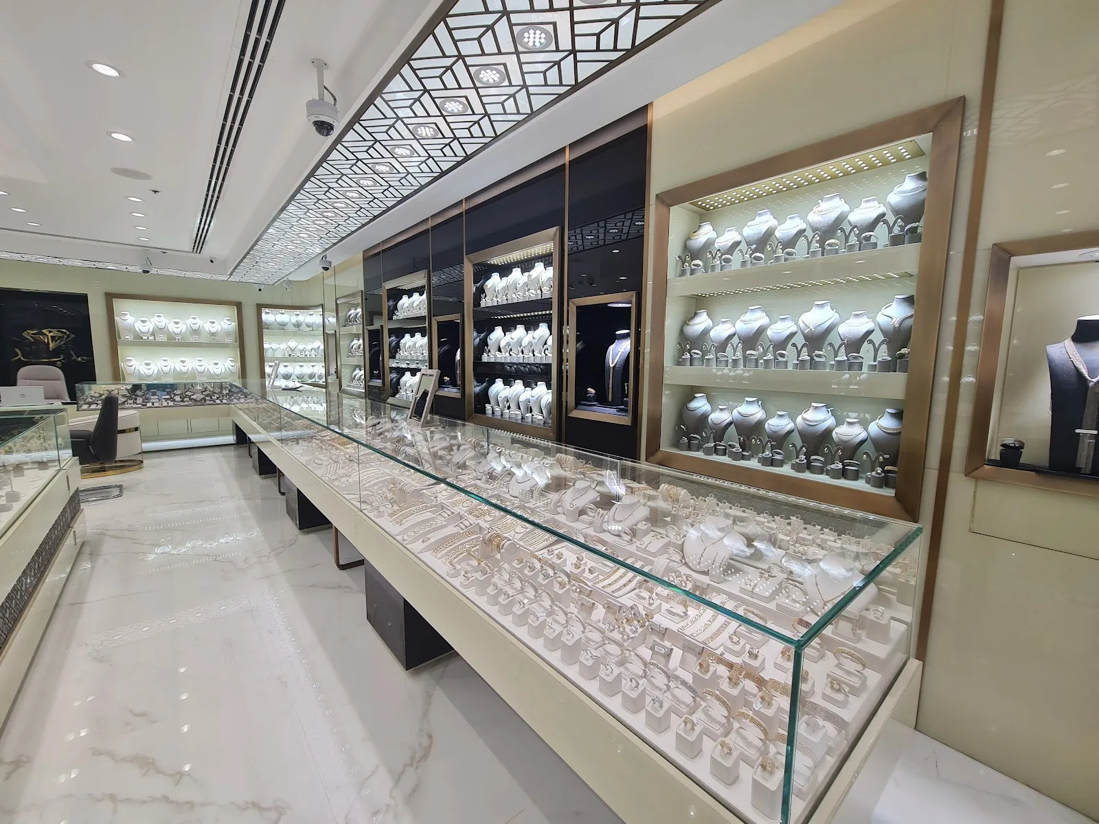 Display counters lined with gold necklaces inside the Hadeed showroom