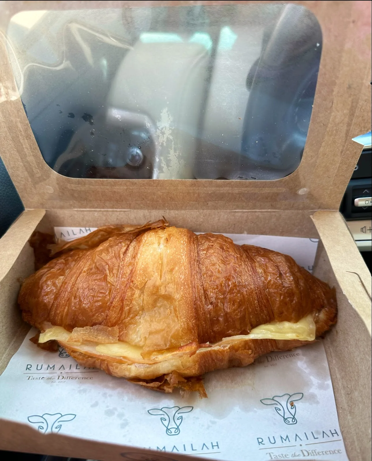 Cheese croissant in a Rumailah takeaway box