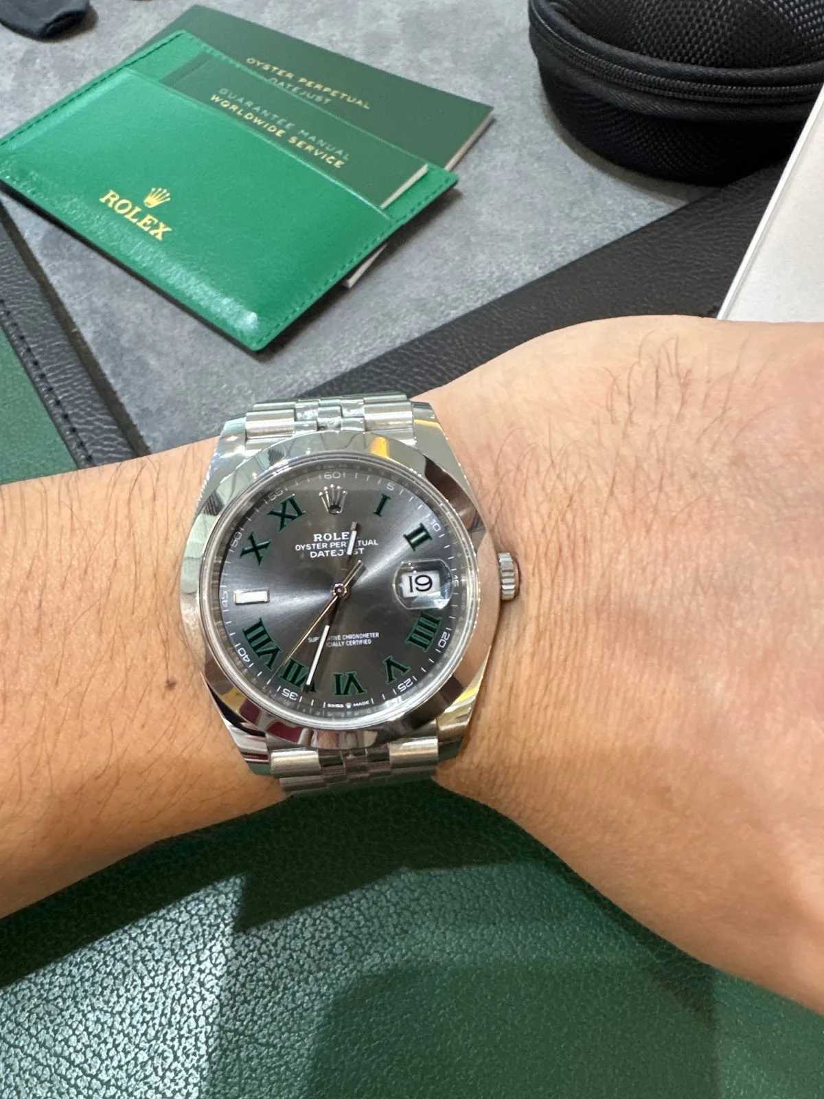 Watch on the wrist with guarantee paperwork