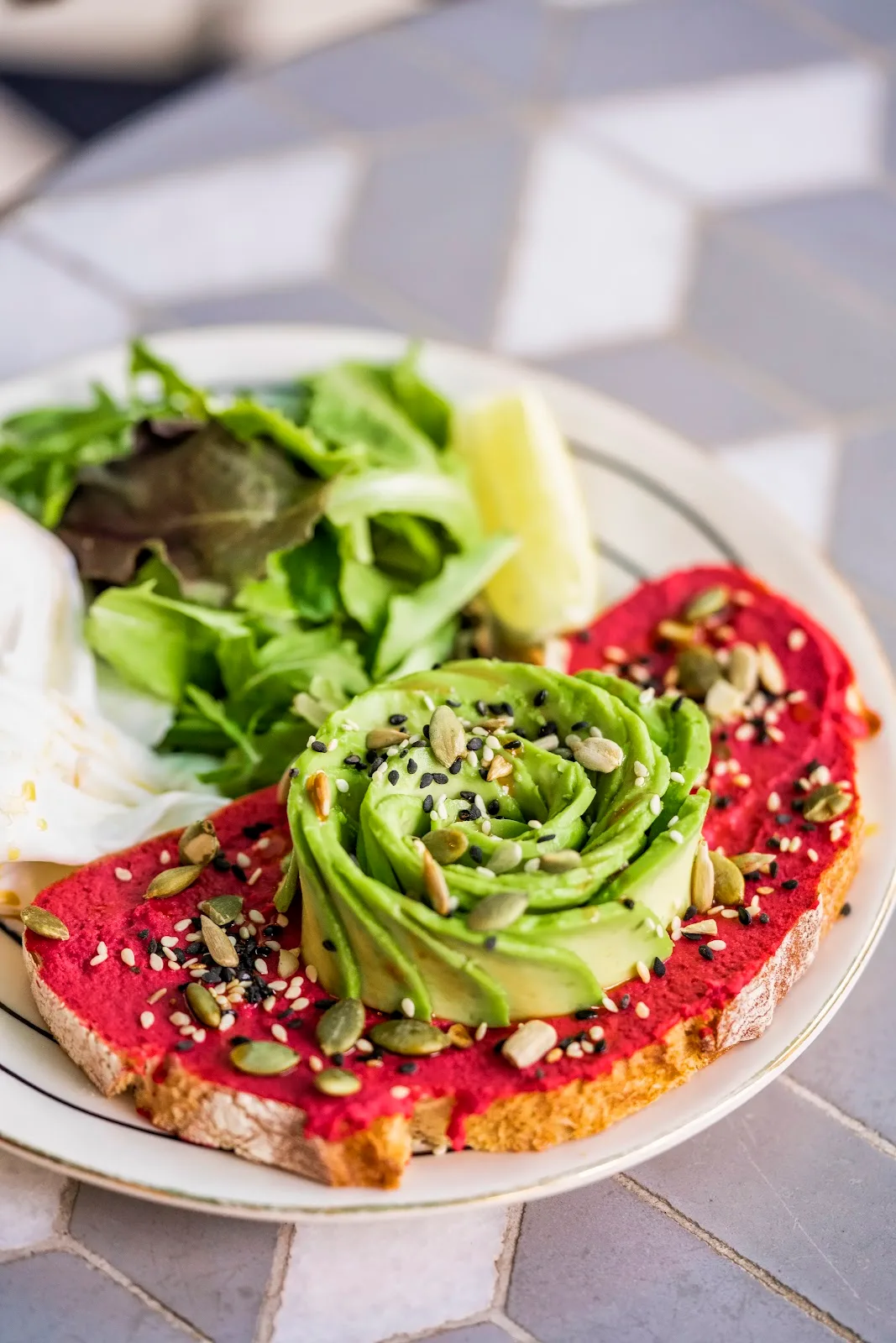 Colourful avocado and beetroot toast.