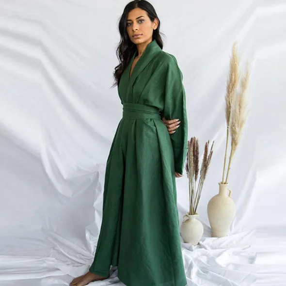 A flowing green linen abaya styled with dried pampas grass.