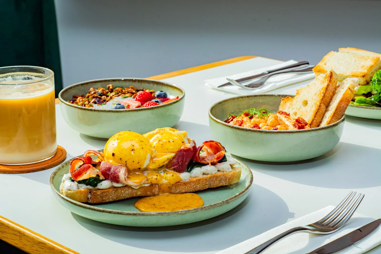 Brunch plates including eggs and grain bowls