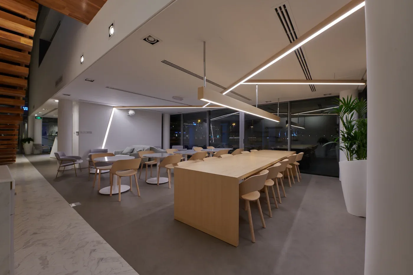 Communal table and lounge seating in the evening