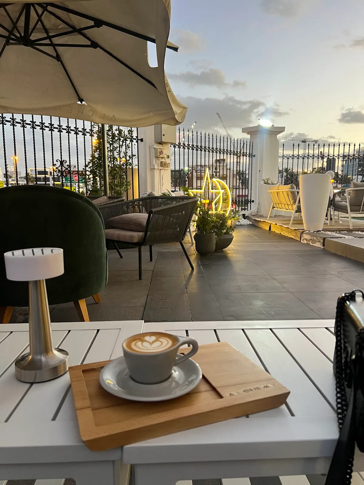 Alchemy Coffee rooftop terrace at sunset