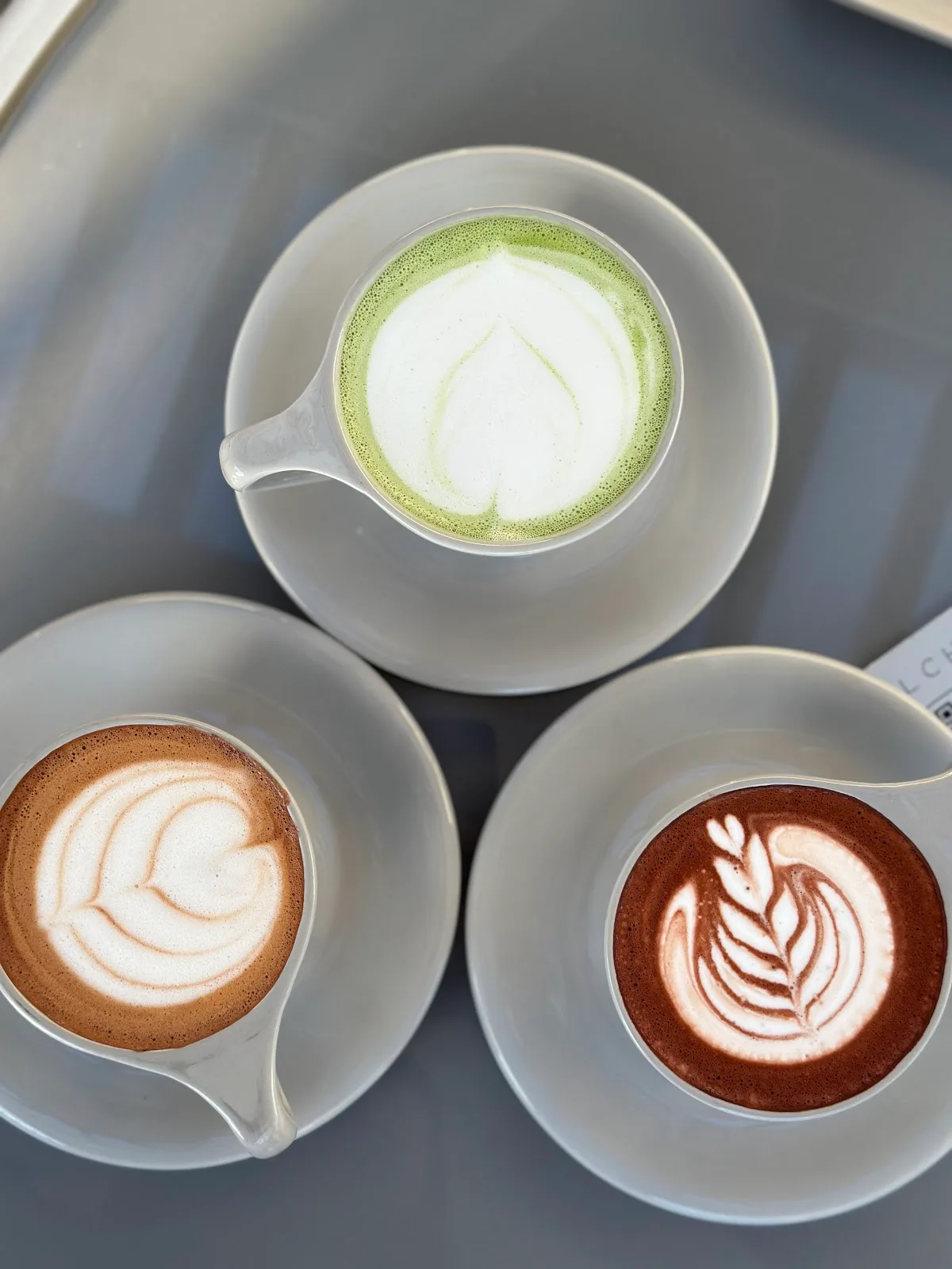 Matcha, mocha and hot chocolate seen from above