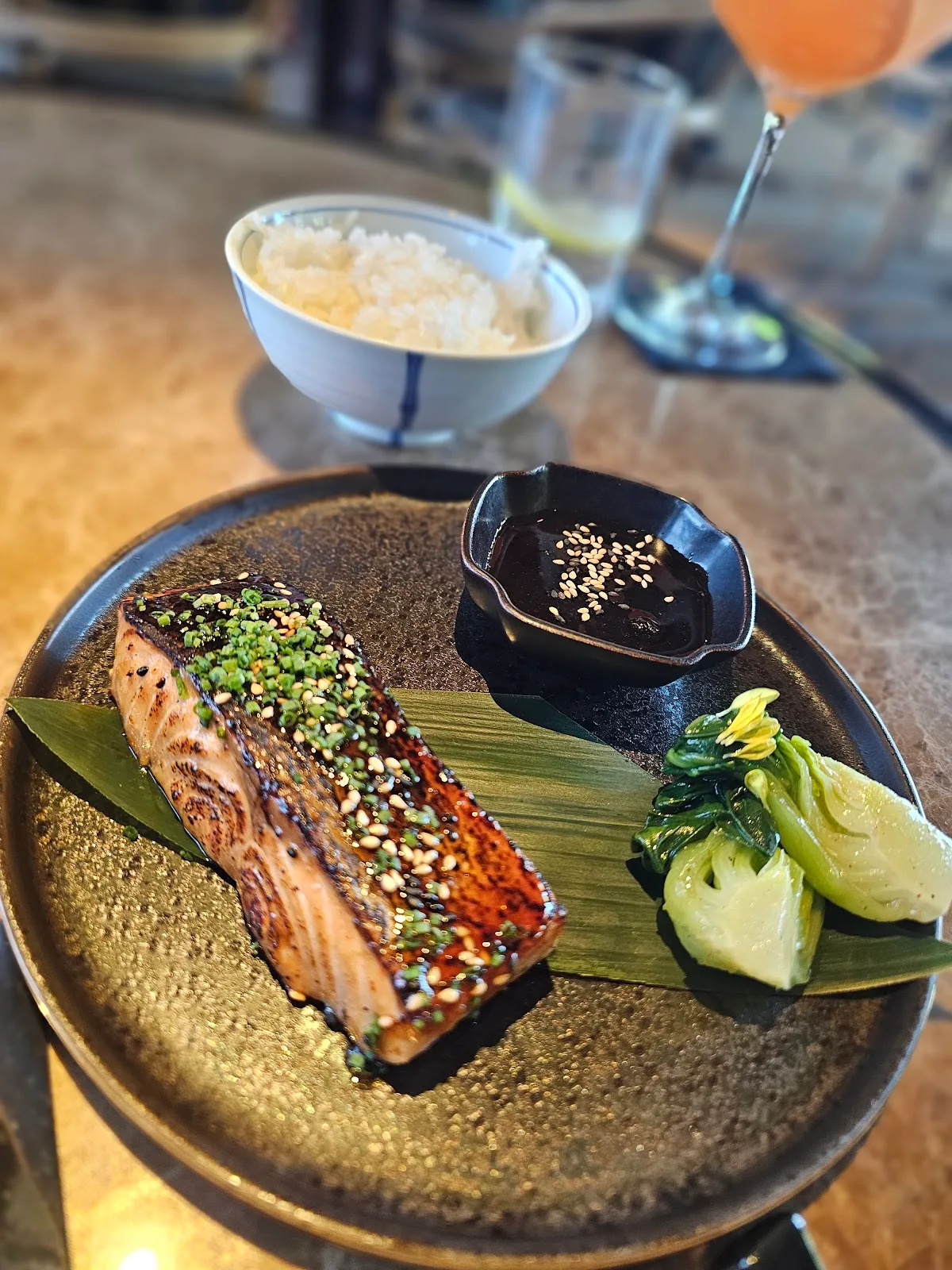 Grilled glazed salmon with greens and rice
