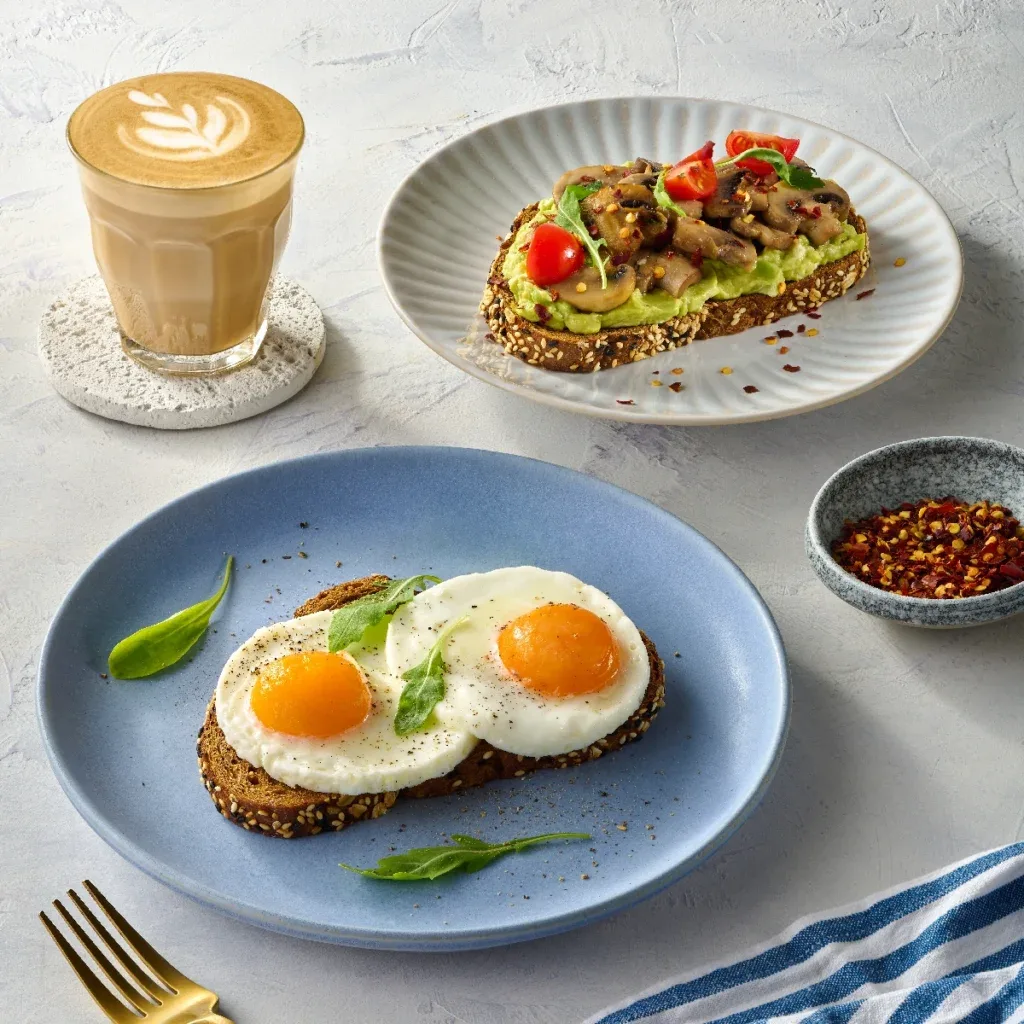 Eggs on toast, avocado mushroom toast and a latte