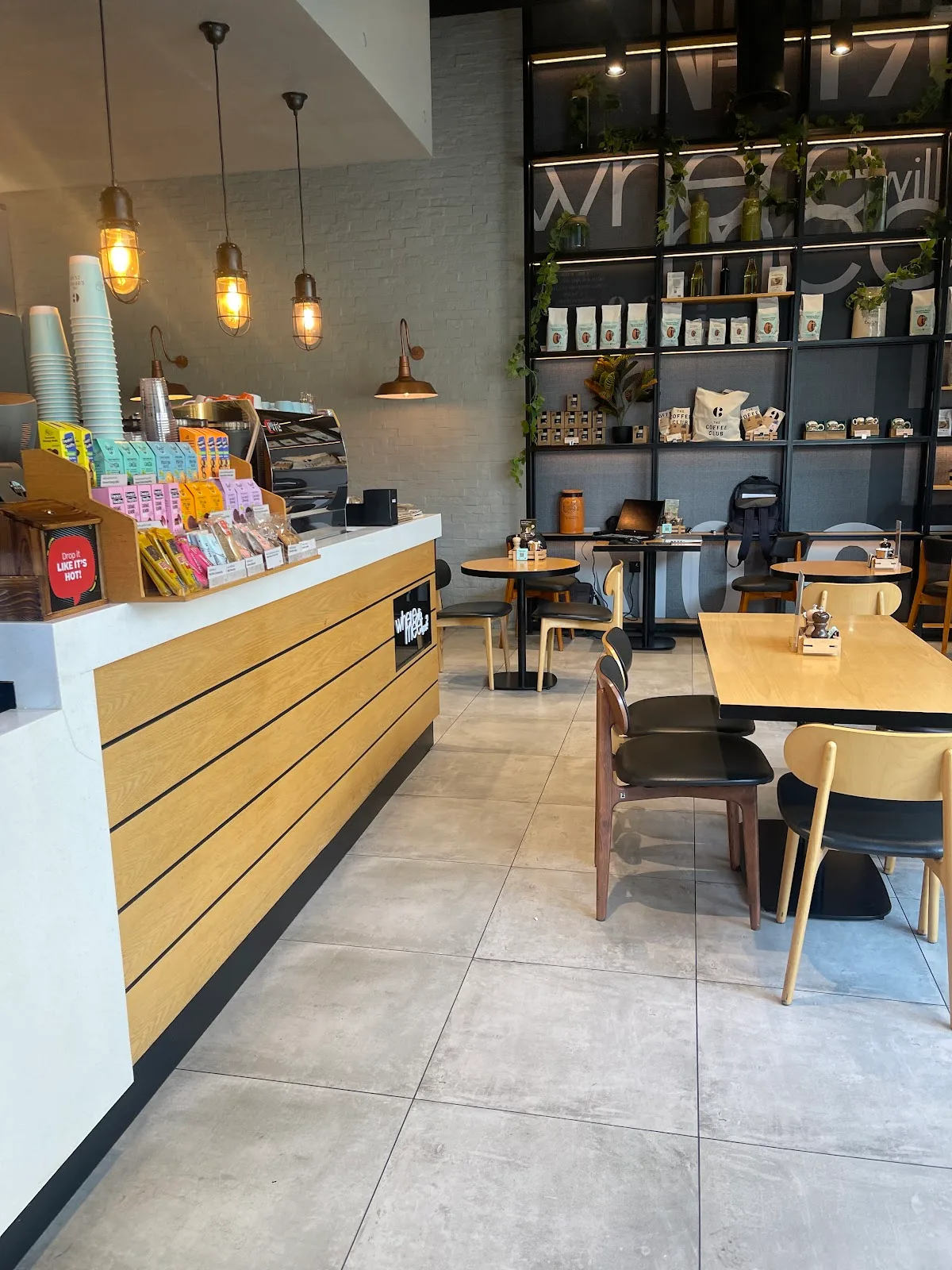 Interior of the café with menu boards and espresso machine