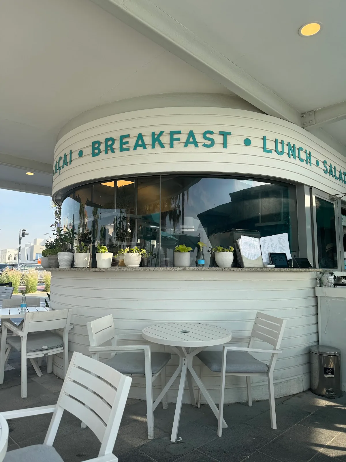The curved café façade with breakfast, lunch and salad lettering