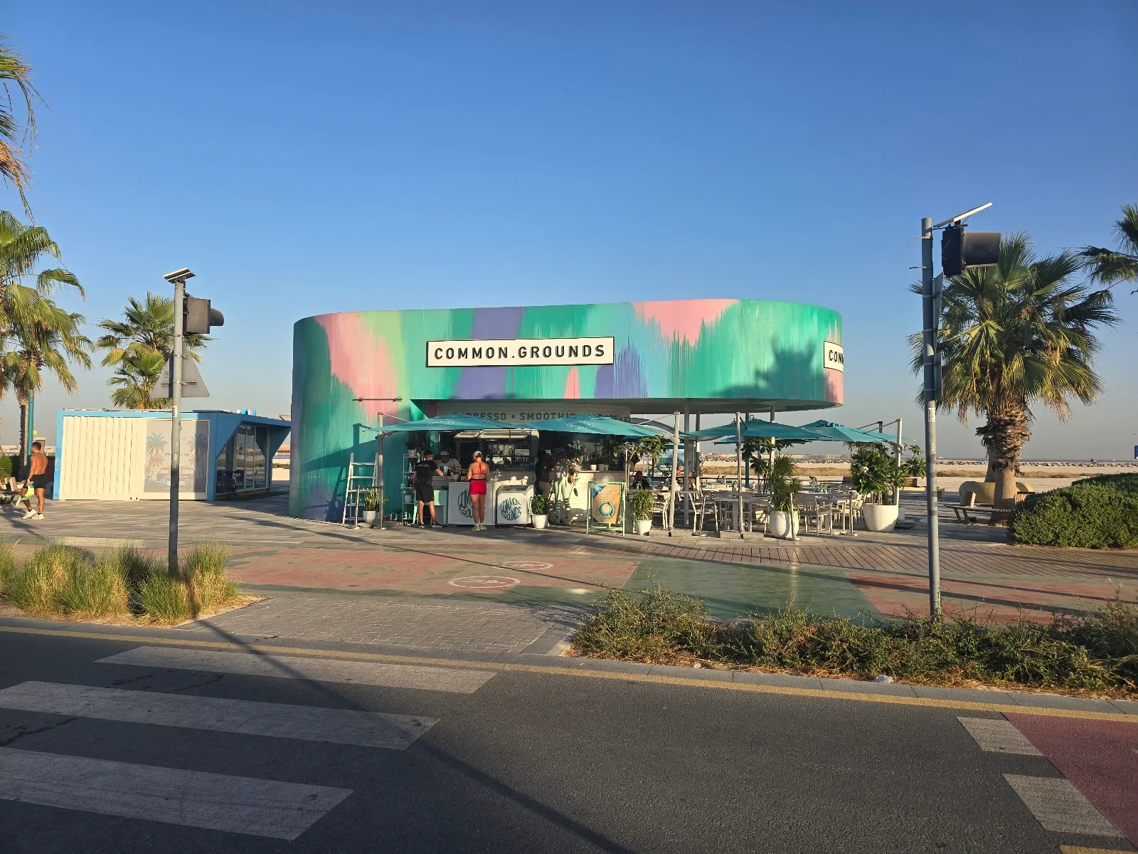 The Common Grounds beachfront café seen across the Kite Beach promenade