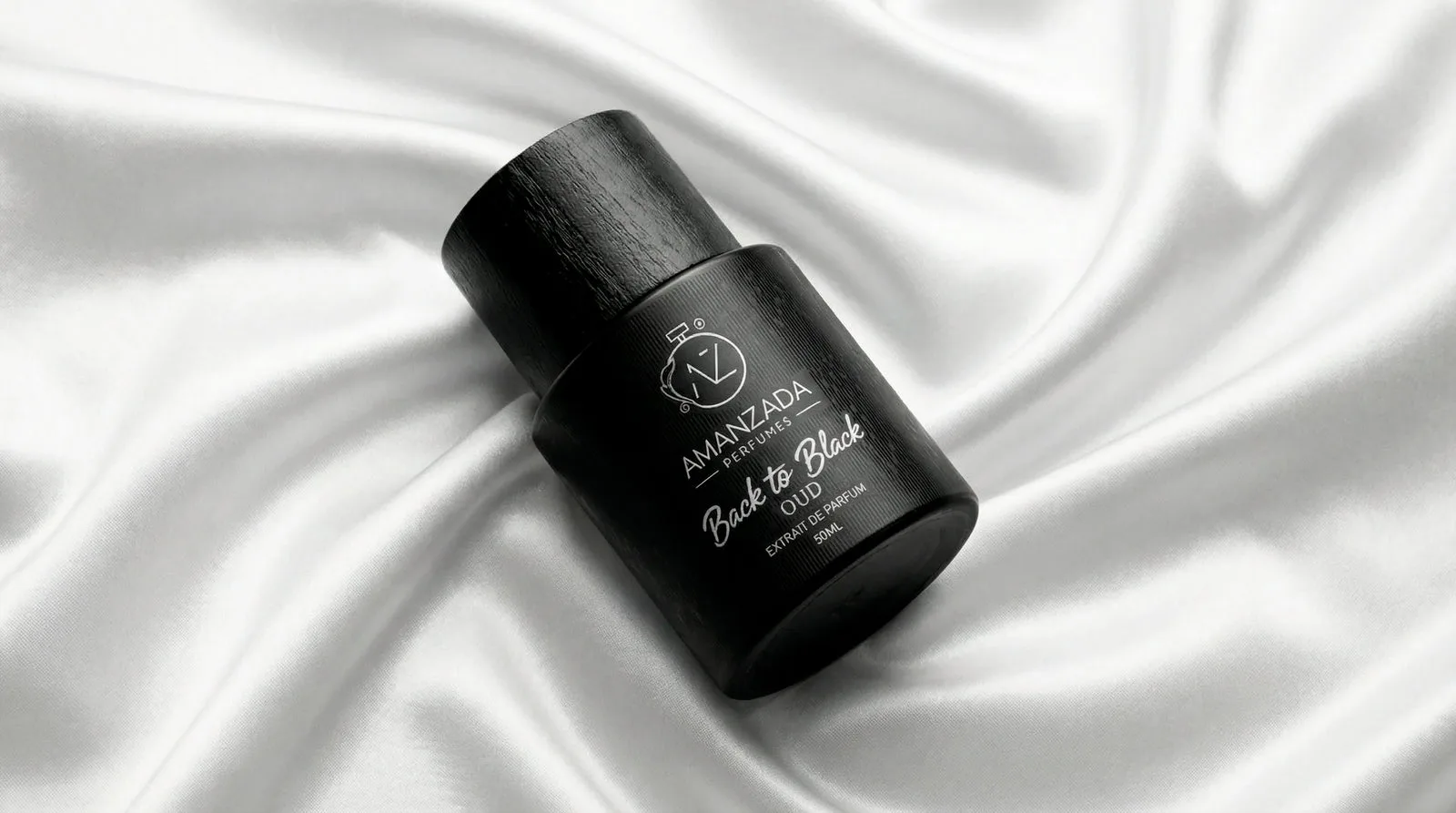 Back to Black bottle resting on white silk