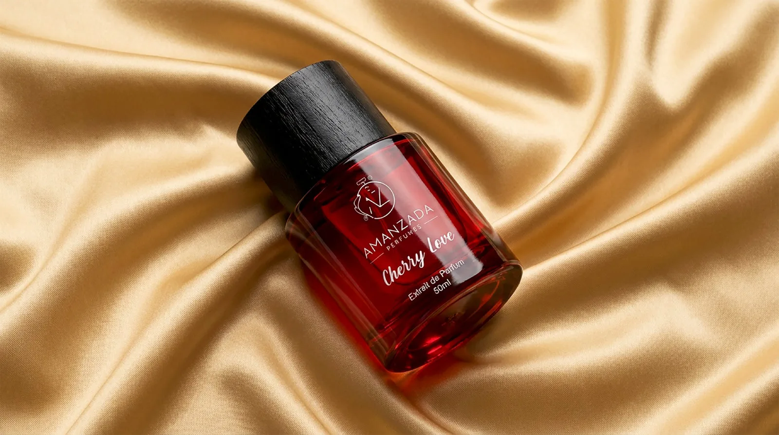 Amanzada Cherry Love extrait de parfum resting on gold silk