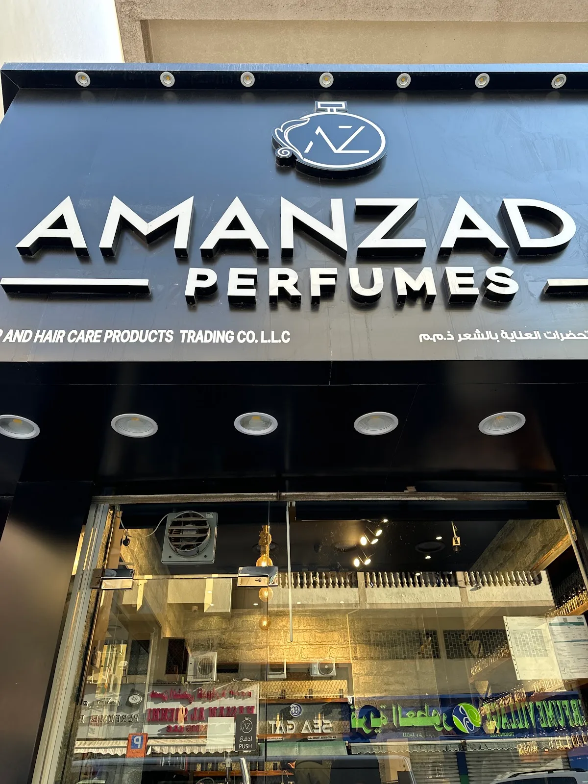 Amanzada Perfumes storefront sign in Al Daghaya, Deira