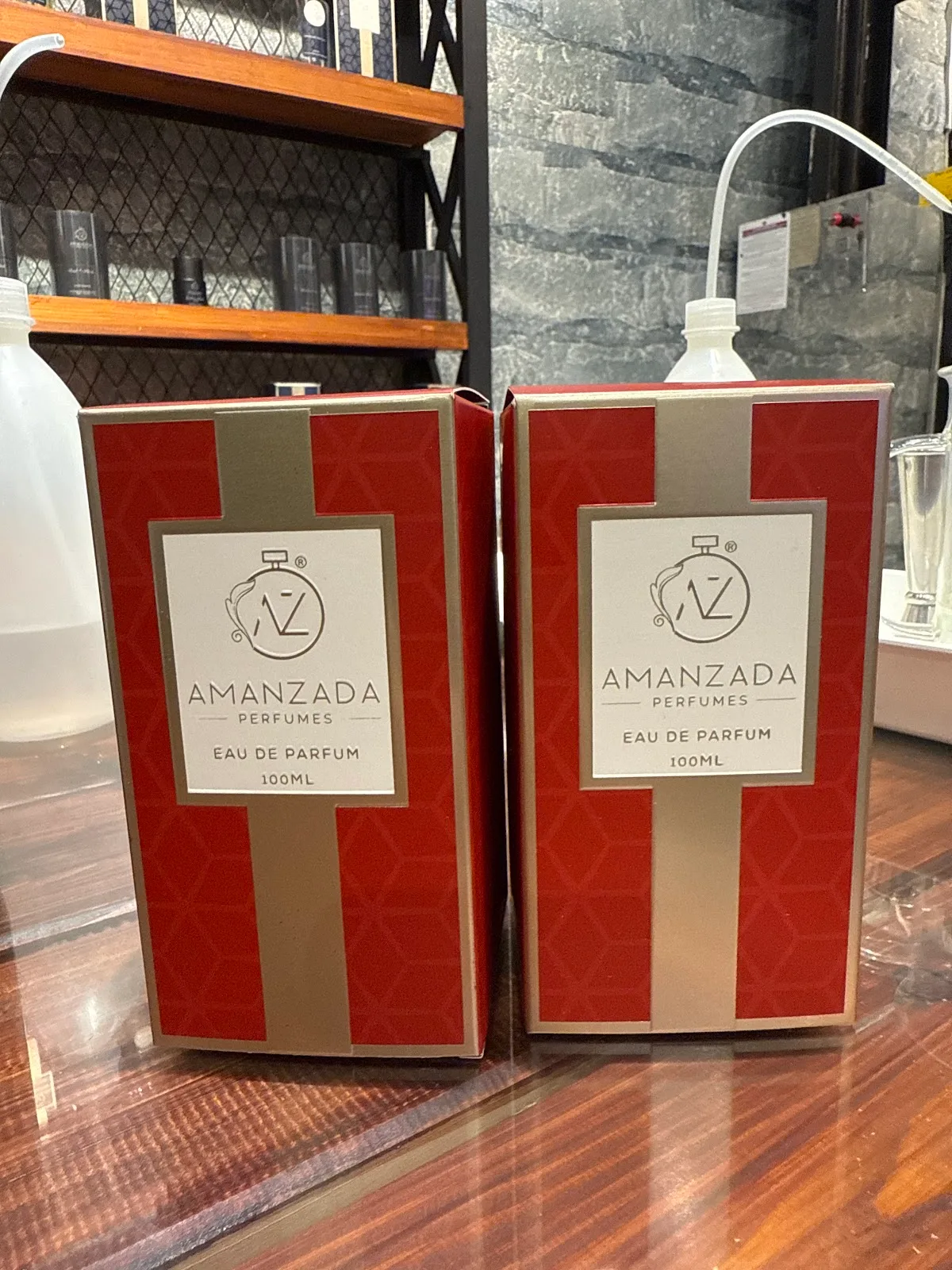 Boxed eau de parfum in red and gold packaging